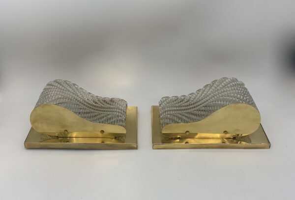 Bifacciali di cristallo; (Coppia) h 13,5 cm, larg. 24,5 cm, spess. 11 cm.