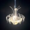 Medusa in lattimo con punte nere; h 85 cm, larg. 49 cm.