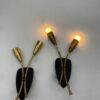 2 luci, base nera con steli in ottone; (coppia) h 32 cm, largh 17 cm, spess. 10 cm.