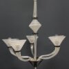 5 luci in vetro cristallo satinato e nero; h 85 cm (con allungo 135 cm) larg. 77 cm.